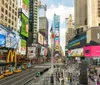 The image captures a bustling Times Square in New York City dotted with bright digital billboards yellow taxis and pedestrians