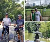 Two people with helmets are smiling for a selfie with a park featuring trees and people in the background suggesting they might be enjoying an outdoor activity like cycling