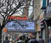 The image shows the marquee of the Apollo Theater advertising an event titled Imaginations Cocktails  Sol Cinema scheduled for a Thursday at 8 PM