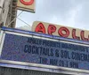 The image shows the marquee of the Apollo Theater advertising an event titled Imaginations Cocktails  Sol Cinema scheduled for a Thursday at 8 PM