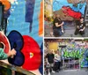 Two people are joyfully displaying their graffiti artwork featuring a large eye with a dynamic and colorful backdrop full of street art