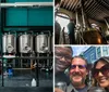 A smiling man and woman pose in front of stainless steel brewing equipment suggesting a setting in a brewery
