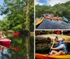 Three people are kayaking in a scenic waterway surrounded by trees with some showing autumnal colors