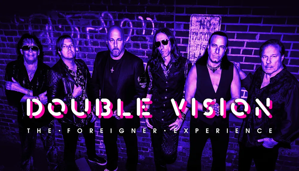 The image features a group of six men standing in front of a brick wall with the text Double Vision The Foreigner Experience in bold purple letters