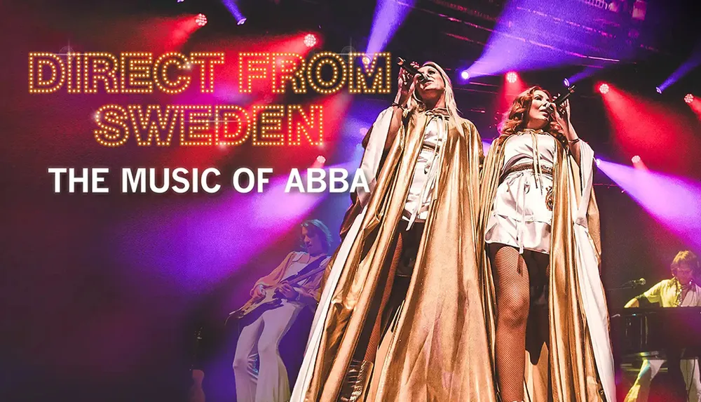 Two performers on stage dressed in gold capes and white outfits sing under bright lights with the text Direct from Sweden The Music of ABBA displayed above them