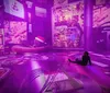 The image depicts a surreal purple-lit room filled with giant toys digital displays and a person sitting on the floor amid oversized objects including a dog with a Santa hat sleeping on a large cushion